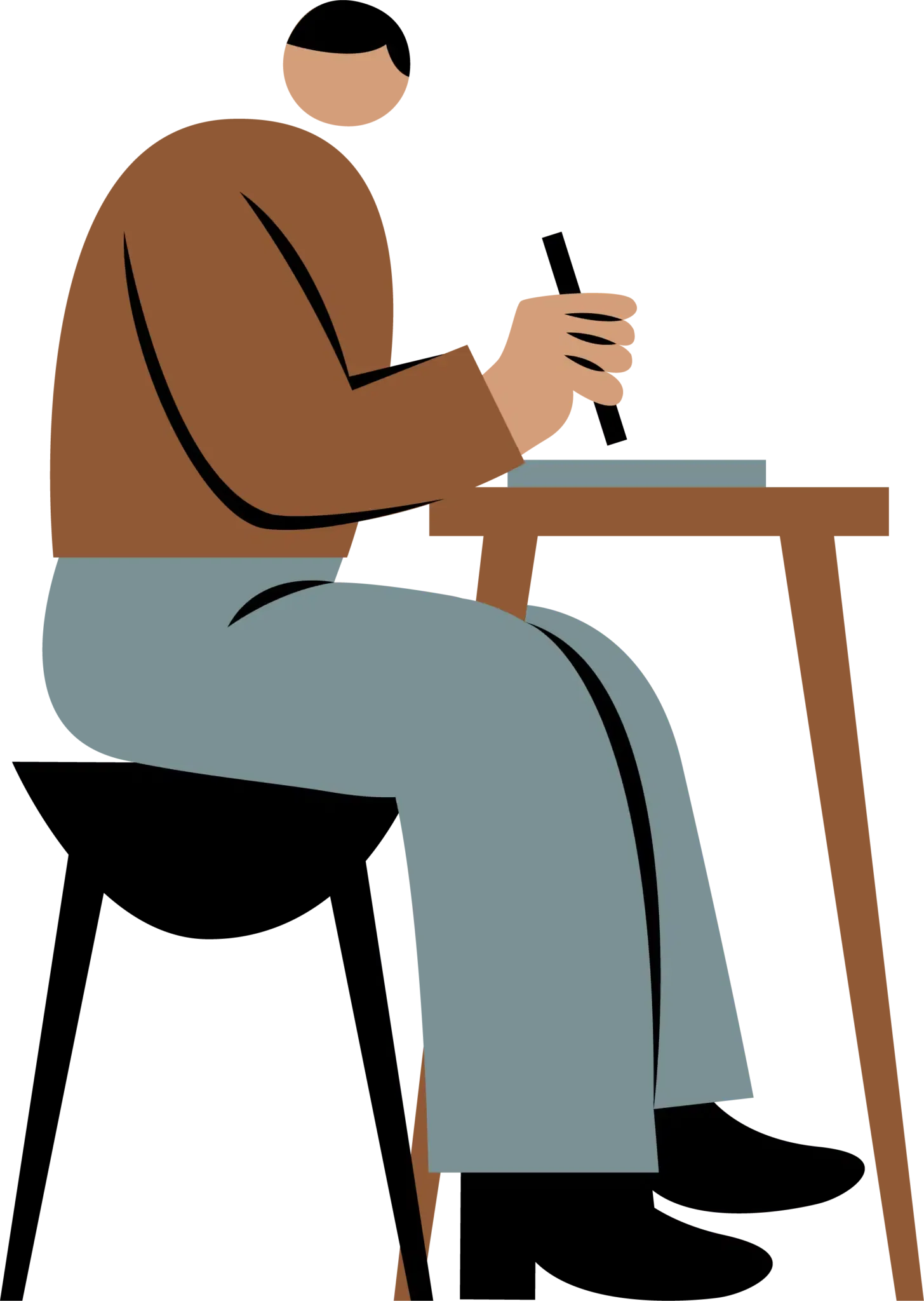 Person sidder ved bord med computer